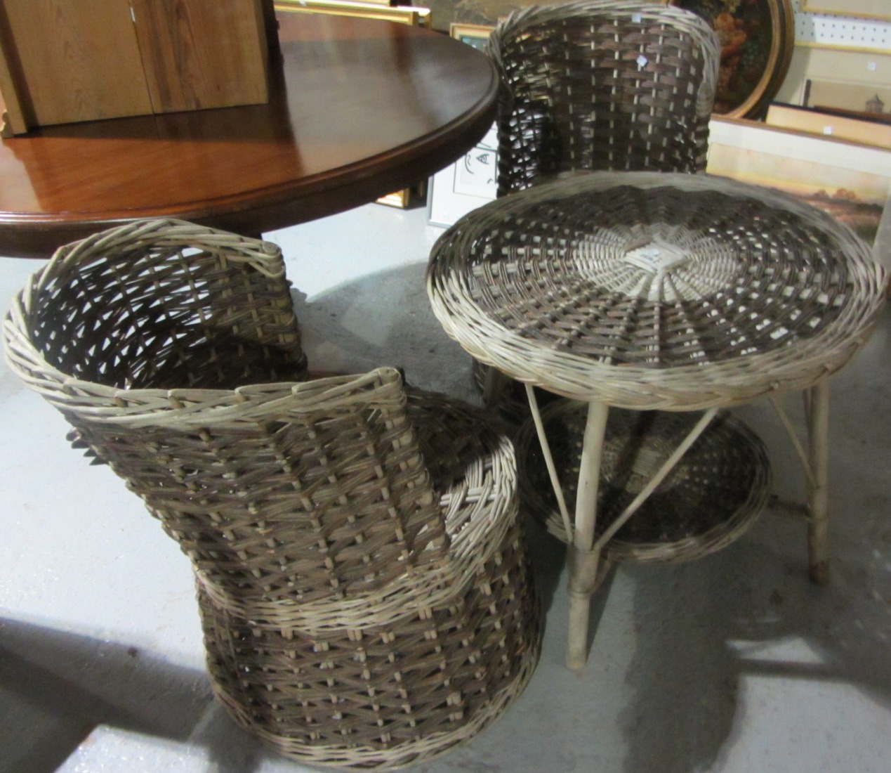 Appraisal: A th century cane garden table and two matching chairs