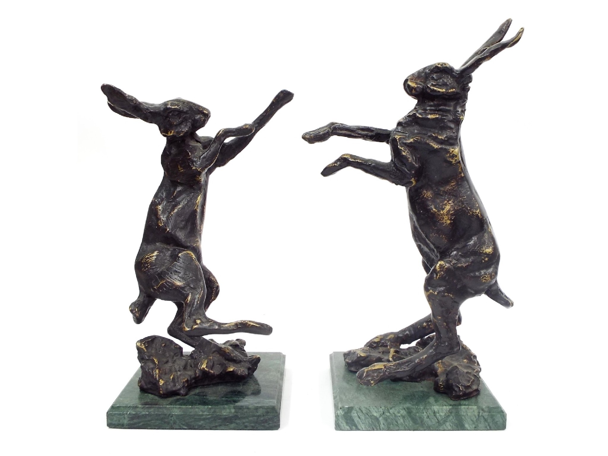 Appraisal: Pair of cast metal bronzed hares upon green marble bases