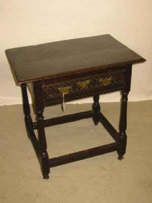 Appraisal: AN OAK SIDE TABLE with moulded edged oblong top frieze