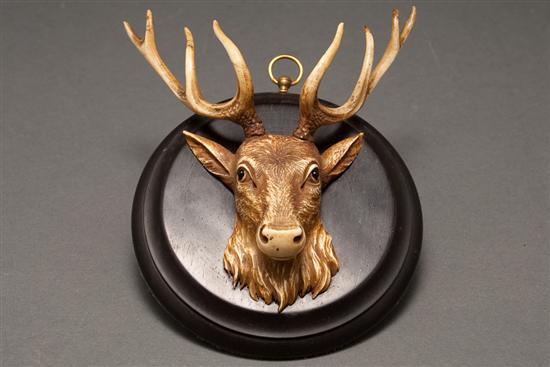 Appraisal: Continental carved ink-washed ivory miniature elk's head mounted on an