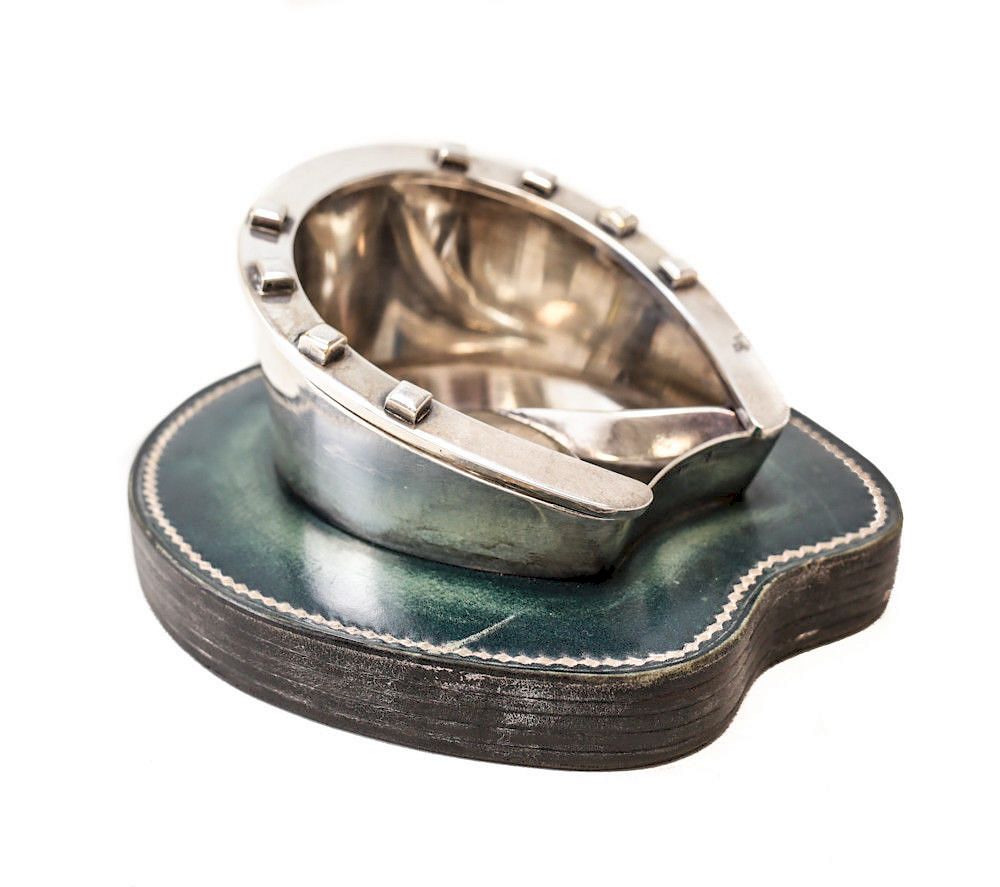 Appraisal: Hermes Silver Plate Horseshoe Ashtray A unique silver plated horseshoe