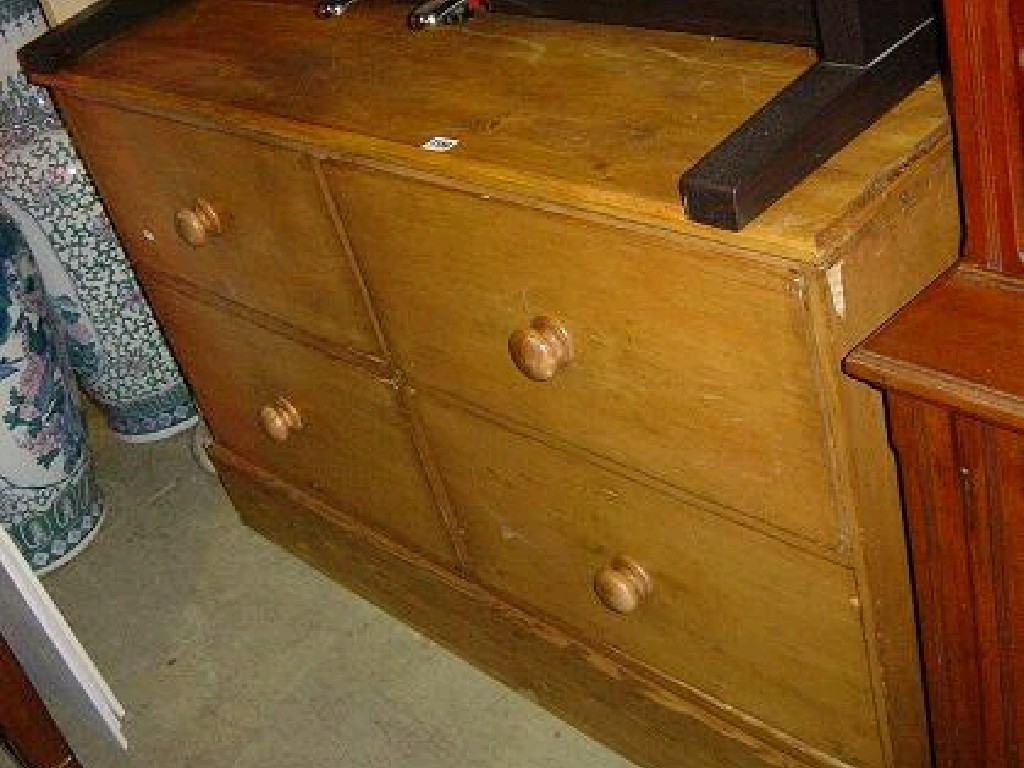 Appraisal: A stripped pine chest fitted with an arrangement of four