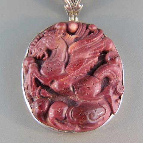 Appraisal: Carved Coral Pendant winged horse sterling silver setting x plus