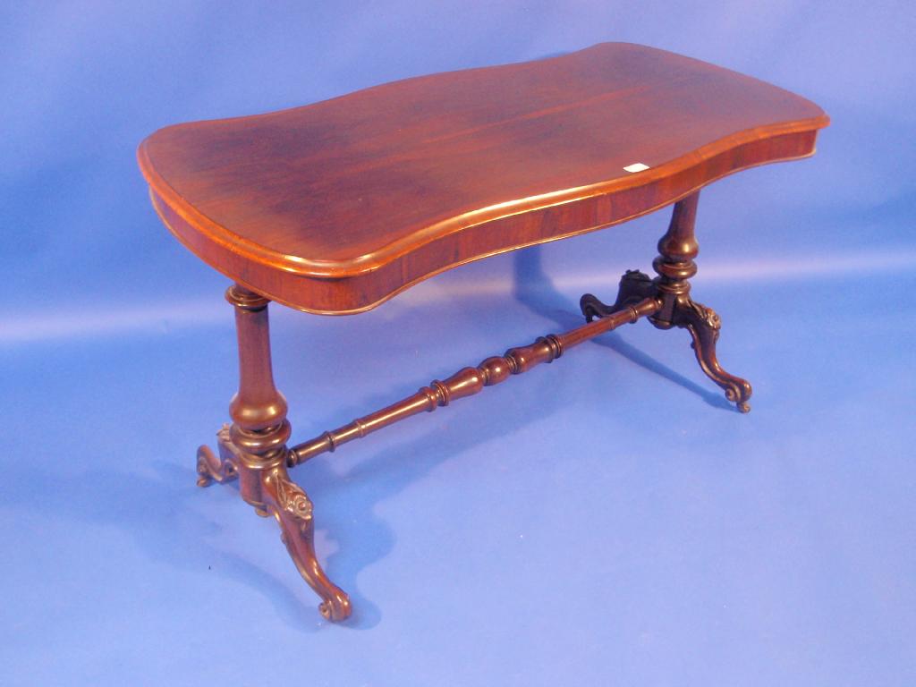 Appraisal: A Victorian rosewood centre table with moulded serpentine top turned