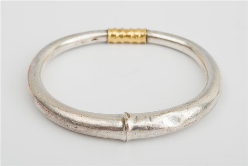 Appraisal: SILVER AND GOLD BANGLE BRACELET Unmarked together with a pair