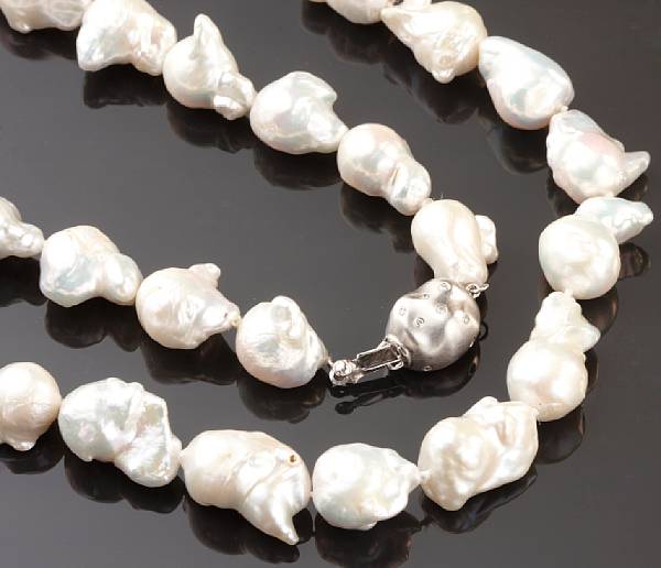 Appraisal: A strand of Baroque cultured pearls with a k white