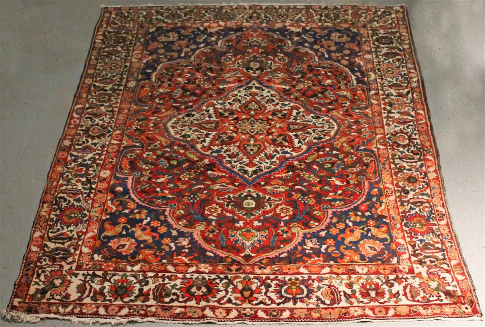 Appraisal: MASHAD ORIENTAL RUG having a red ground with a central