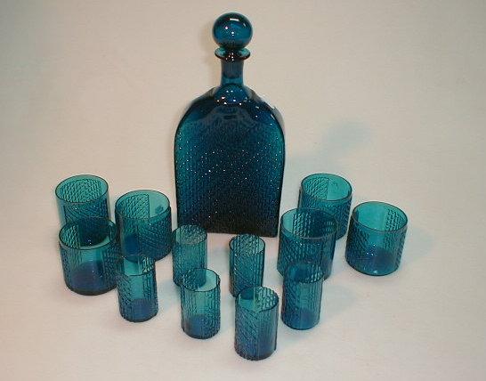 Appraisal: A 's turquoise glass textured squared decanter with six matching