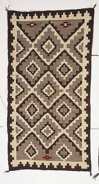 Appraisal: A Navajo rug The stepped diamond latticework with small serrated