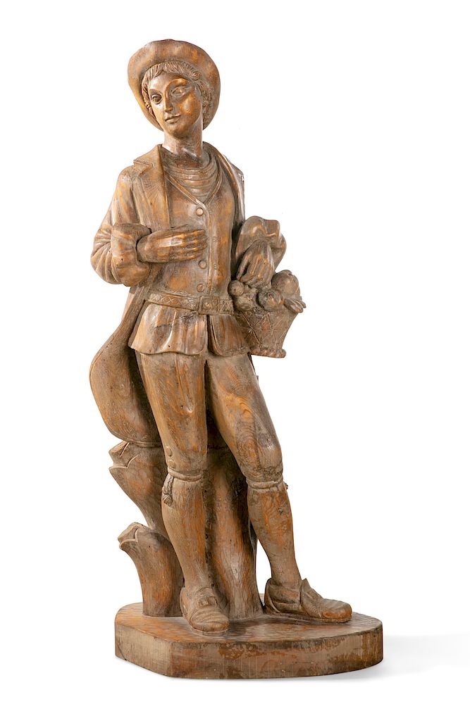 Appraisal: A Spanish carved pine figure of a fruit vendor A