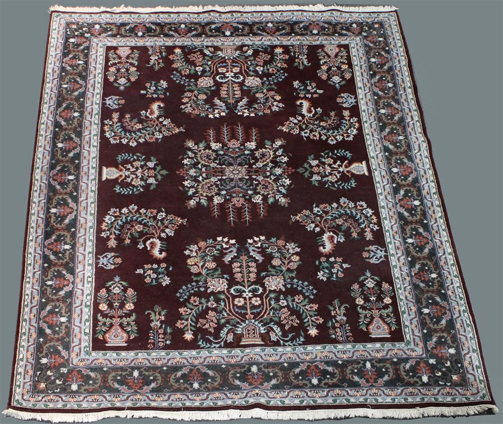 Appraisal: LARGE INDO-PERSIAN ORIENTAL WOOL RUG blues pink burgundy green and