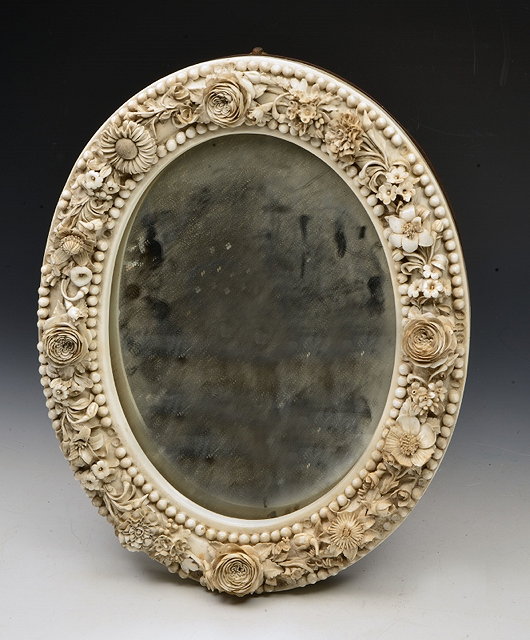 Appraisal: A STEVENSON HANCOCK DRESSING TABLE MIRROR with floral encrusted and