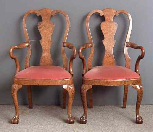 Appraisal: A pair of s grained as burr walnut armchairs of