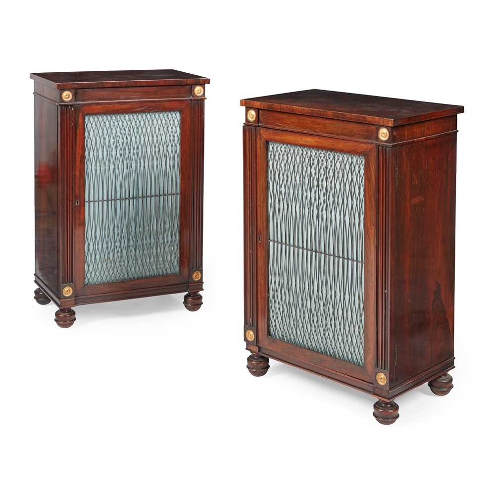 Appraisal: Y PAIR OF REGENCY ROSEWOOD PARCEL-GILT AND BRASS SIDE CABINETS