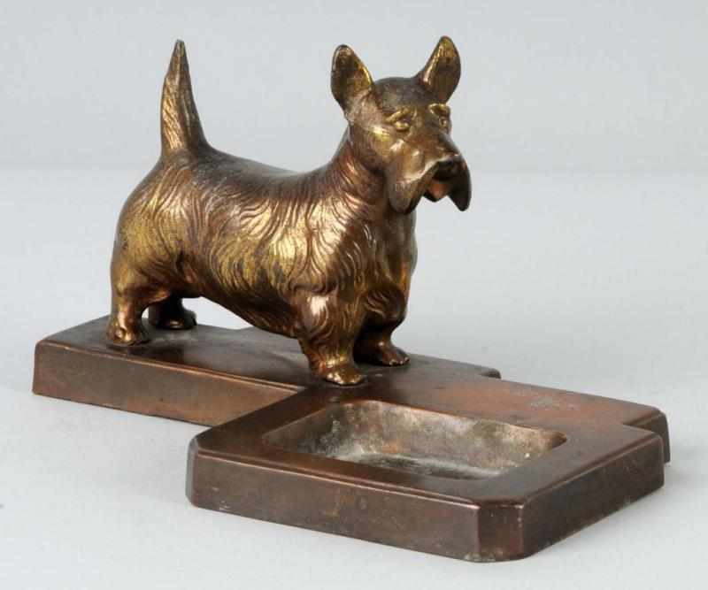 Appraisal: Standing Scottie Pin Tray Description Spelter Large standing Scottie on