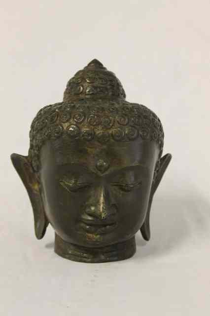 Appraisal: A CAST CHINESE COPPER ALLOY of the head of a