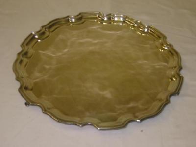 Appraisal: A SALVER of circular form with moulded Chippendale border raised