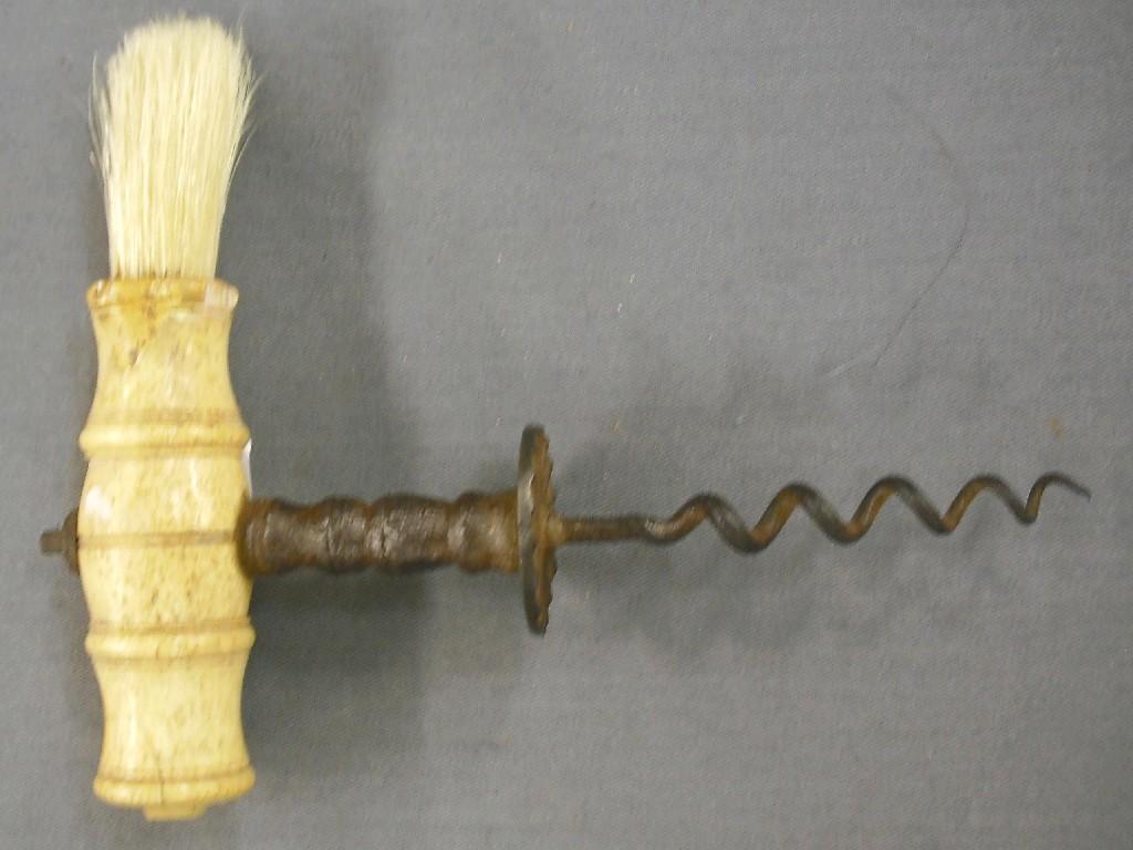 Appraisal: th century corkscrew with turned bone handle and applied brush