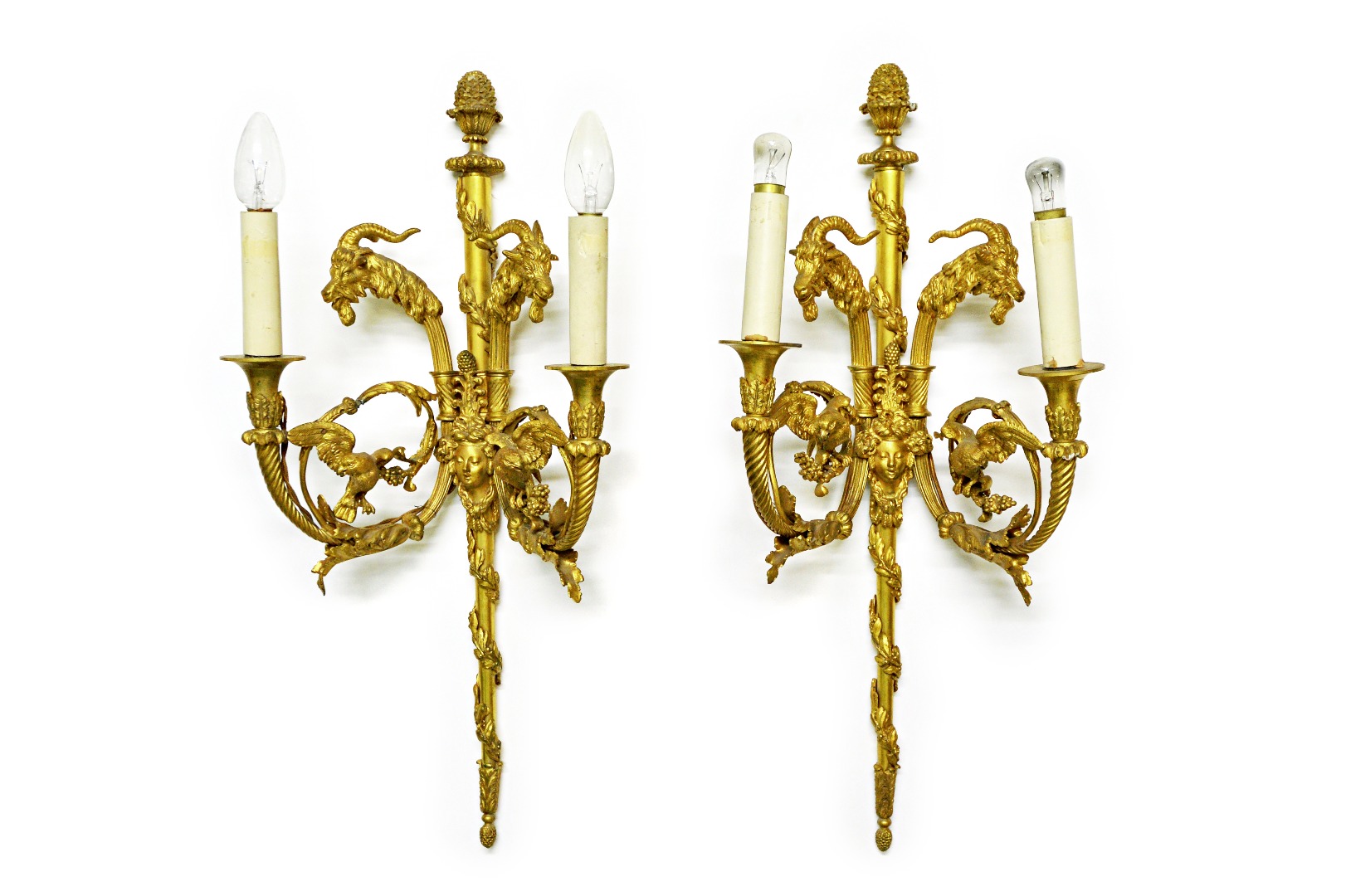 Appraisal: A pair of French ormolu twin light wall appliques th