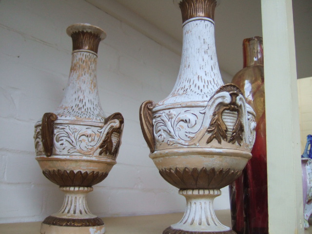 Appraisal: A pair of Grecian style pottery vases moulded with gilt