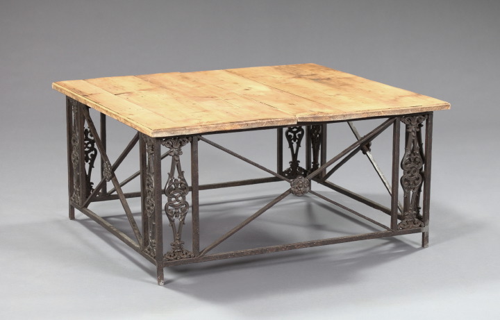 Appraisal: Unusual Iron and Pickled Pine Cocktail Table the plank top