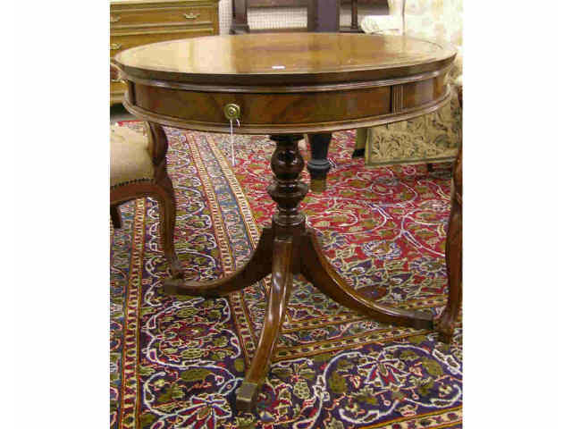 Appraisal: Duncan Phyfe style mahogany drum table with leather top and