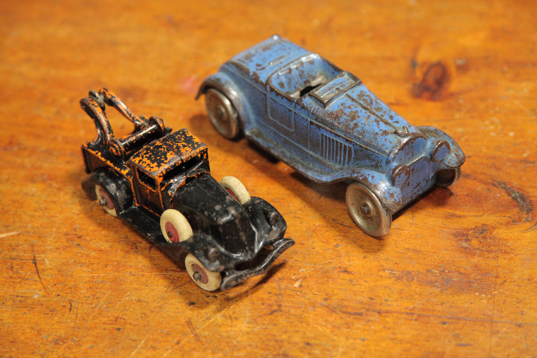 Appraisal: TWO CAST IRON AUTOMOBILES American early th century An Arcade