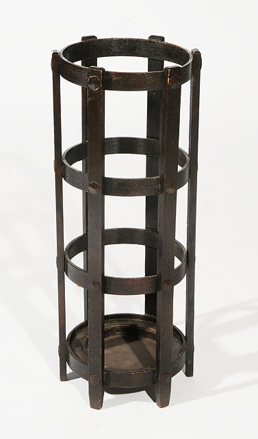 Appraisal: A LIBERTY OAK STICK STAND of circular open form circa