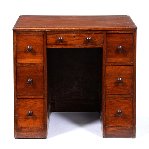 Appraisal: An oak kneehole desk the sides panelled cm h c