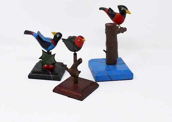 Appraisal: signed Tom King wooden birds signed Tom King wooden birds