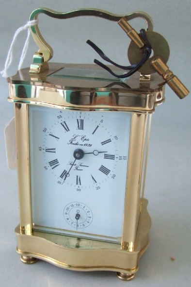 Appraisal: A modern brass cased carriage timepiece with alarm of serpentine