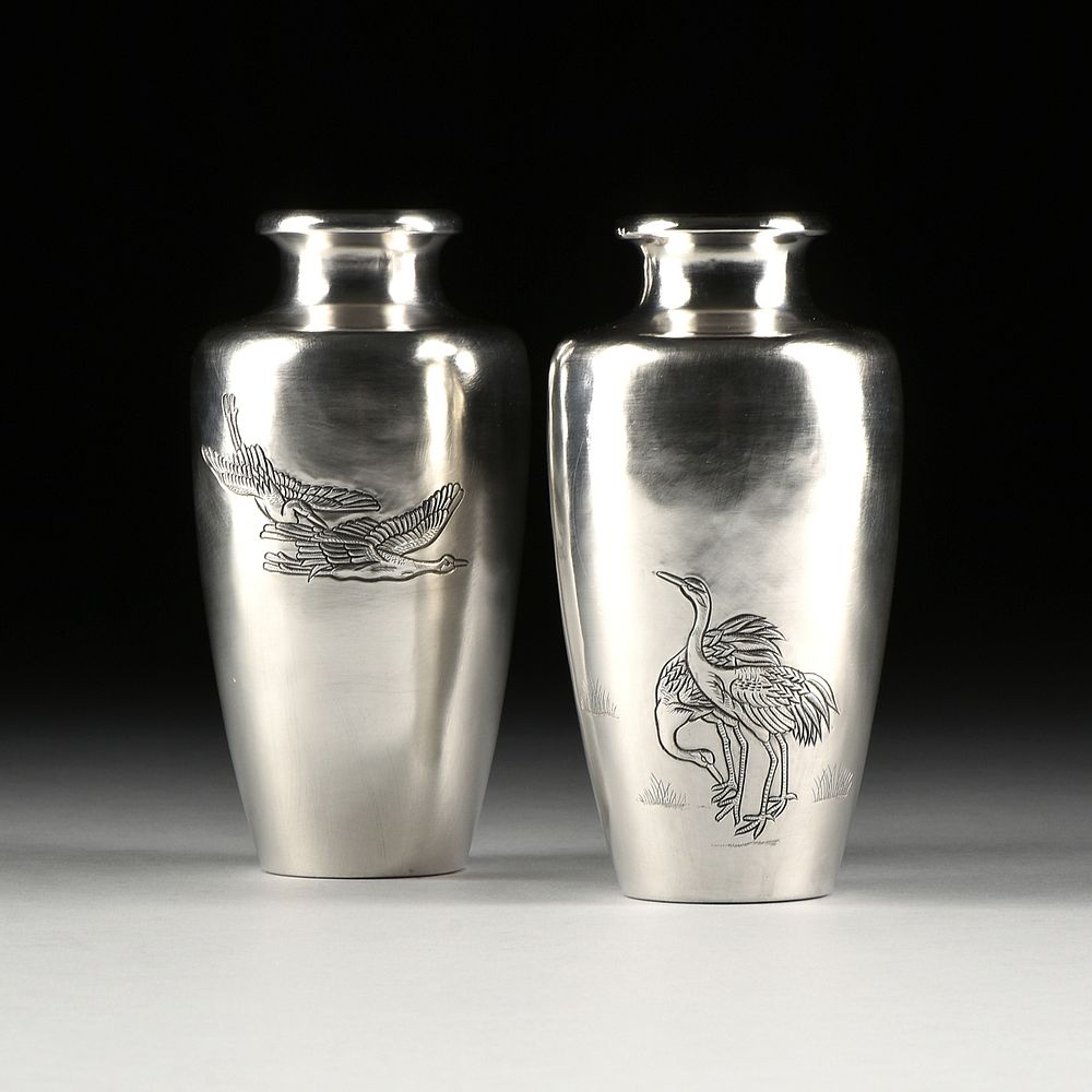 Appraisal: A PAIR OF WATANABE ZO STERLING SILVER REPOUSS CRANE VASES