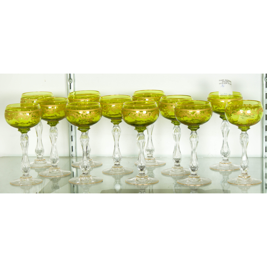 Appraisal: SET OF EUROPEAN GILT HIGHLIGHTED CUT GREEN GLASS WINE GLASSES