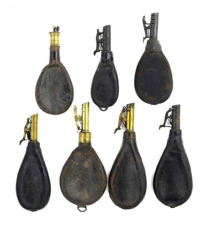 Appraisal: SEVEN VICTORIAN LEATHER SHOT FLASKS with lacquered brass or steel