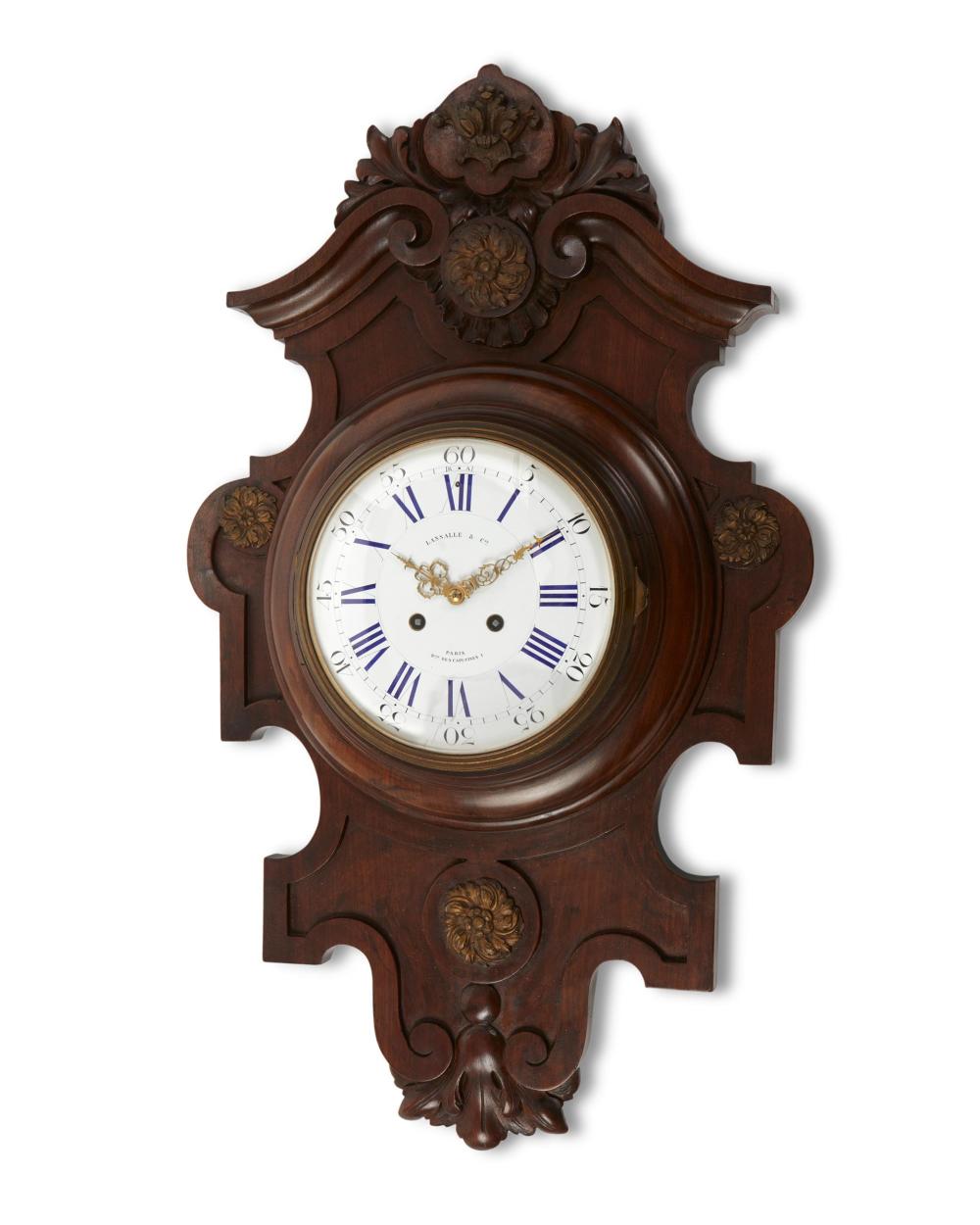 Appraisal: A French carved walnut wall clock Fourth-quarter th Century Dial