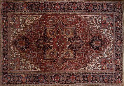 Appraisal: HERIZ CARPET NORTHWEST PERSIA The red and blue medallion anchored