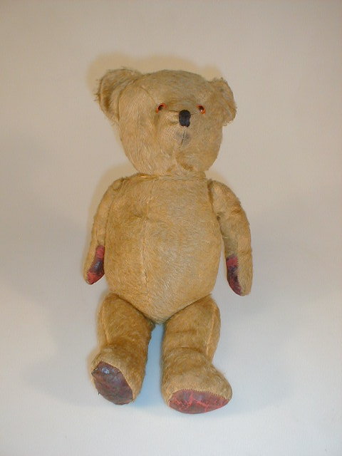 Appraisal: A mid thC teddy bear with short golden mohair plush