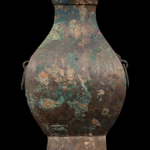 Appraisal: A Chinese Bronze Archaistic Vessel Fanghu the bulbous body rising