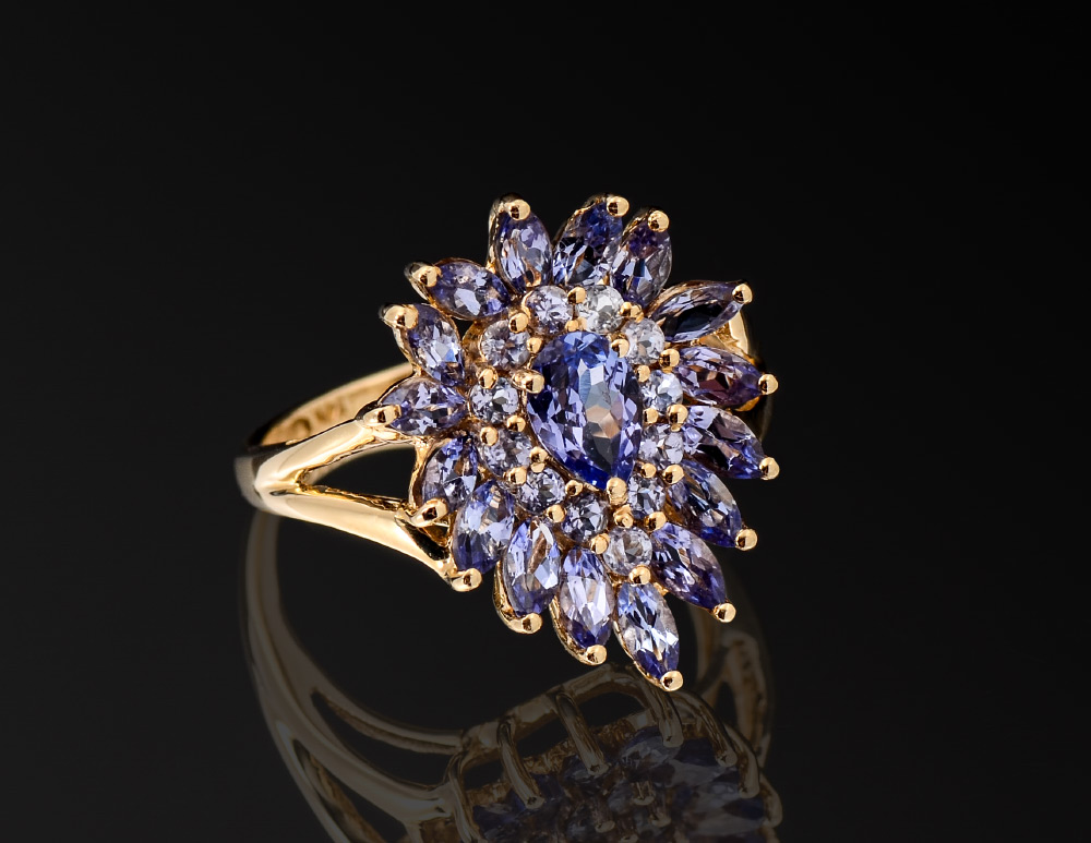 Appraisal: TANZANITE DINNER RING K yellow gold ring contains mixed cut