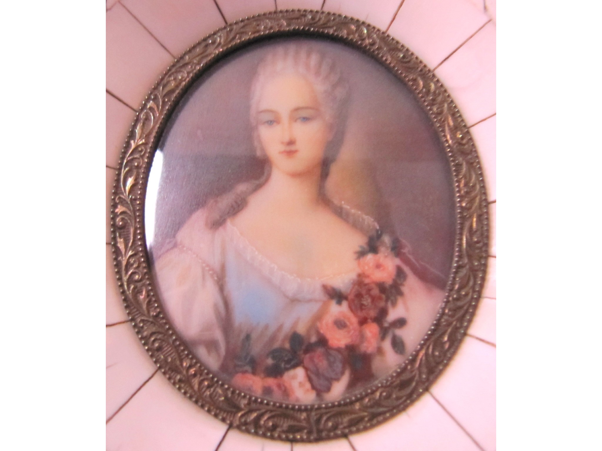 Appraisal: A portrait miniature - a lady with flower garland