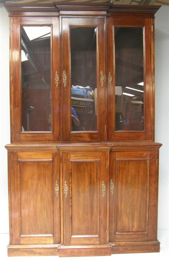 Appraisal: th century mahogany breakfront library bookcase with three glazed cupboard