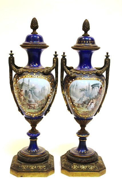 Appraisal: A PAIR OF FRENCH PORCELAIN AND GILT METAL MOUNTED URNS