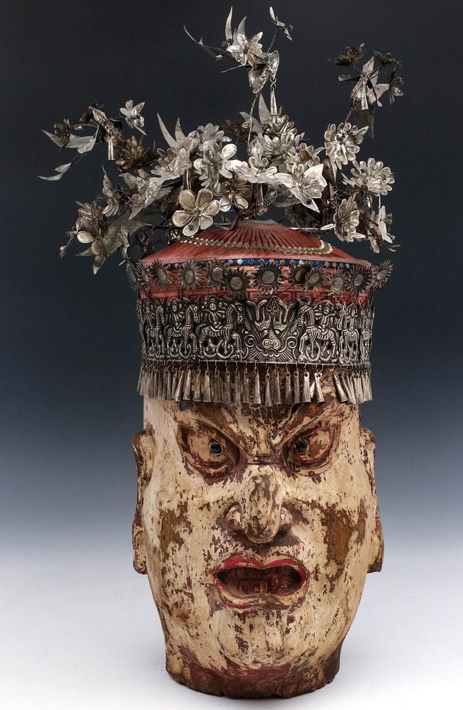 Appraisal: ELABORATE CHINESE MIAO HEADDRESS ON UNRELATED CARVING The Miao people