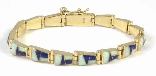 Appraisal: OPAL AND LAPIS LAZULI BRACELET k yellow gold inlaid with