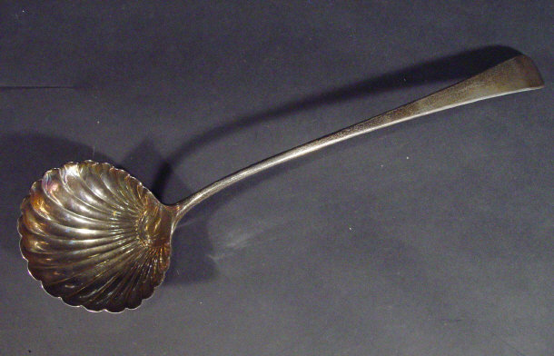 Appraisal: Georgian silver ladle with shell shaped bowl indistinctly hallmarked cm