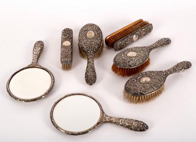 Appraisal: A quantity of silver-backed dressing table items comprising three hairbrushes