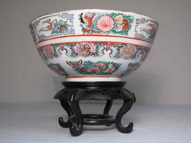 Appraisal: Chinese hand painted porcelain center bowl on a carved wood