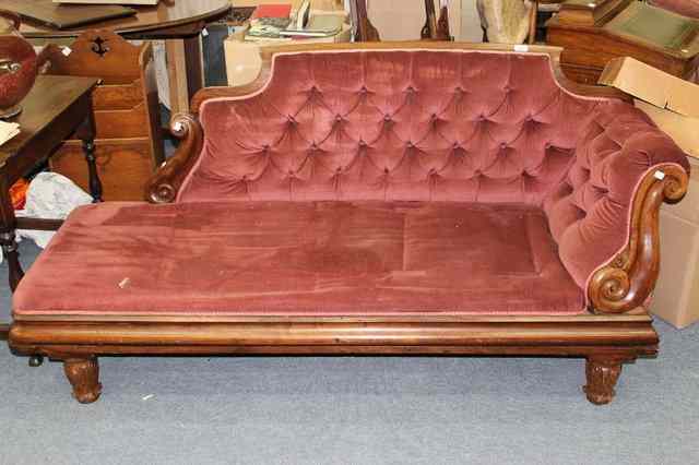 Appraisal: A VICTORIAN ROSEWOOD CHAISE LONGUE with overstuffed button upholstered back