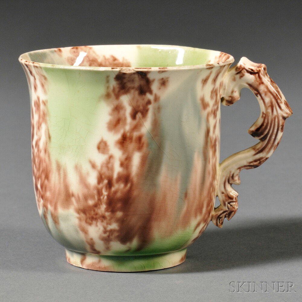 Appraisal: Staffordshire Cream-colored Earthenware Coffee Cup England c press-molded foliate handle