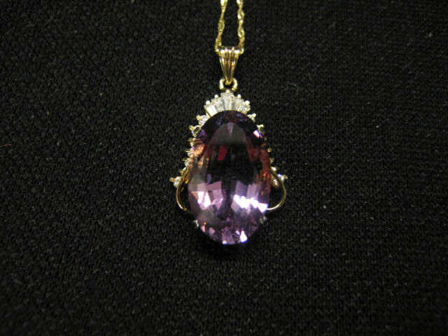 Appraisal: Amethyst Diamond Pendant rich oval gem with round and tapered